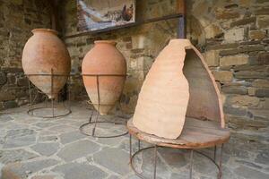 Sudak. Crimea. Russia - October 9, 2024 - Large ancient amphora in the museum. Antique vessel, clay pot for water and wine, bronze terracotta photo