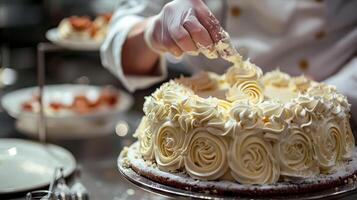 A chef is cutting a cake with a knife photo