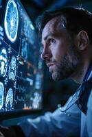 A man in a lab coat is looking at a computer screen with mri images photo