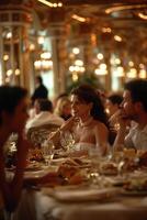 A woman sitting at a table with a man and a woman photo