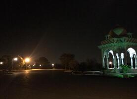 A park at night with a gazebo lit up photo