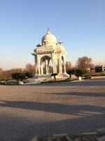 A white building with a dome photo
