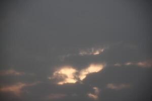 A plane flying through the clouds photo