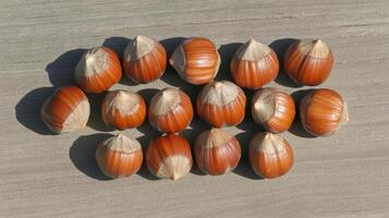 Close Up of Hazelnuts on a Wooden Surface photo