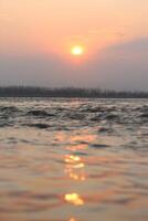 A sunset over the water photo