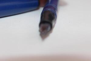 A pen on a table photo