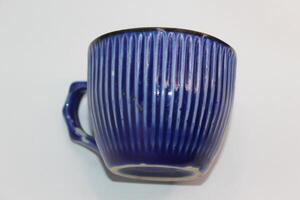 A blue and white cup with a stripe pattern photo