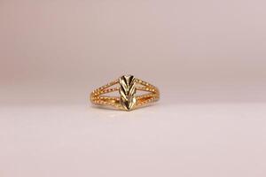 A gold ring with a diamond pattern on it photo