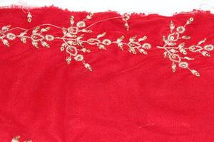 A red cloth with gold embroidery on it photo