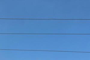 A plane flying over a blue sky photo