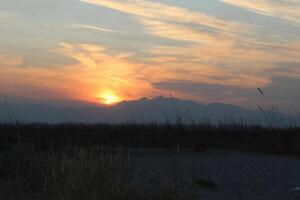 Beautiful clouds across the sky at sunset or sunrise photo