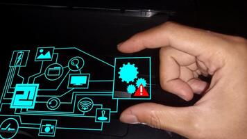 hand holding warning alert on setting in circuit board photo