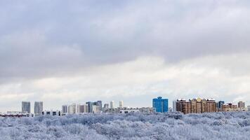 snow clouds over town and city park after snowing photo