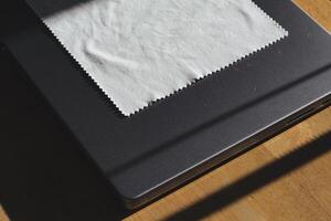 Microfiber Cloth on Laptop Computer photo