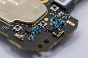 Close-up of Electronic Circuit Board Fragment with Components photo