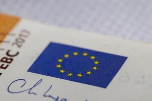 Close-up of European Union Flag and Partial Text on Document photo