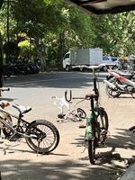 a group of bikes parked on the side of the road photo