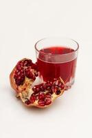 Pomegranate and Pomegranate Juice on white background photo