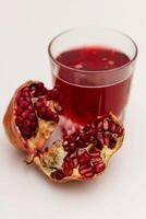 Pomegranate Juice on white background photo