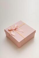 Pink celebrated gift box lie on white background photo