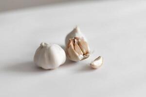 Garlic cloves on a white background photo
