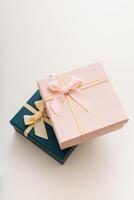 Two celebrated gift boxes lie on white background photo