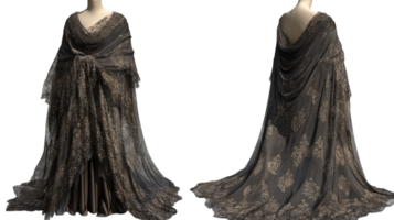 Elegant dark gown with intricate gold patterns displayed on a dress form in a studio setting at daylight. png