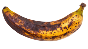 Ripe banana with brown spots resting on a white background captured during daylight hours png