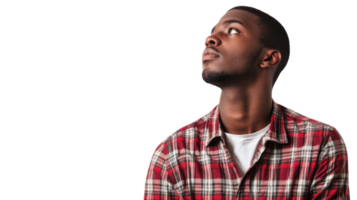 Man gazes thoughtfully upward in a studio setting with neutral background during a modeling session png