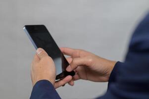 Close-up of Hands Using Smartphone in Professional Setting photo