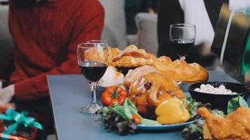 A table with a turkey, bread, and wine video