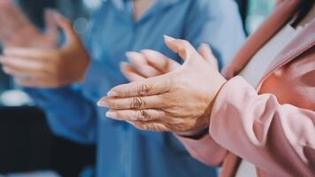 Close up of hands clapping in a business meeting video