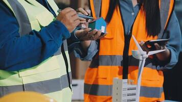 Two people in safety vests working on a project video