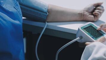 A person is checking the blood pressure of another person video