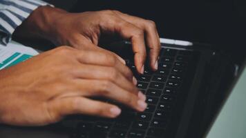 Close up of a person typing on a laptop video