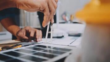 A person is working on a solar panel video