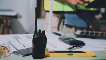A man is working on a project with a radio video