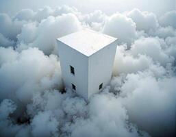 A white building is surrounded by clouds photo