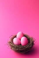 Soft pink eggs nestled in a rustic bird's nest on a vibrant magenta backdrop exuding warmth and tranquility photo