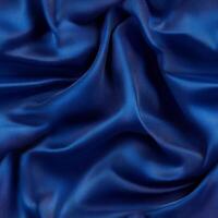Captivating blue silk seamless pattern draping gracefully under studio lighting showcasing elegance and refinement in luxurious fabric design photo