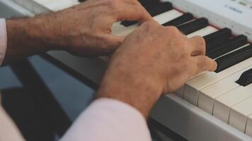 A person playing the piano with their hands video