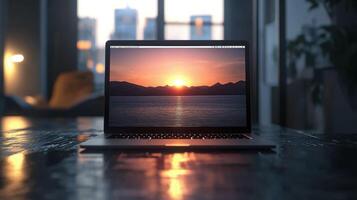 laptop displaying sunset over water, creating serene atmosphere photo