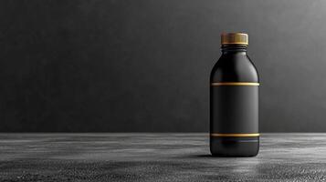 Matte black water bottle with gold cap on textured surface photo