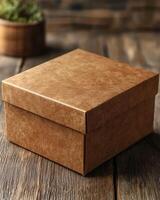 Brown packaging box with textured surface on wooden table photo