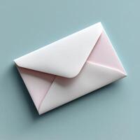 Elegant pink envelope on soft blue background, perfect for invitations photo