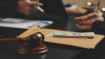 A judge's gavel and money on a desk video