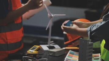 Two people working on a wind turbine video