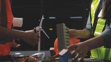 Two people working on a wind turbine video
