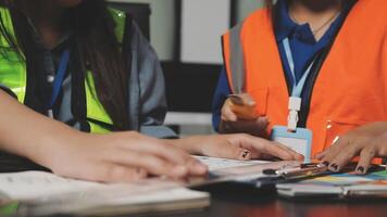 Two women in safety vests working on paperwork video