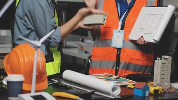 Two people in safety vests are talking about something video